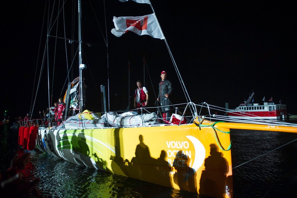 Team Sanya pull into the dock at the finish of leg 8, from Lisbon, Portugal, to Lorient, France, during the Volvo Ocean Race 2011-12.  © Paul Todd/Volvo Ocean Race http://www.volvooceanrace.com