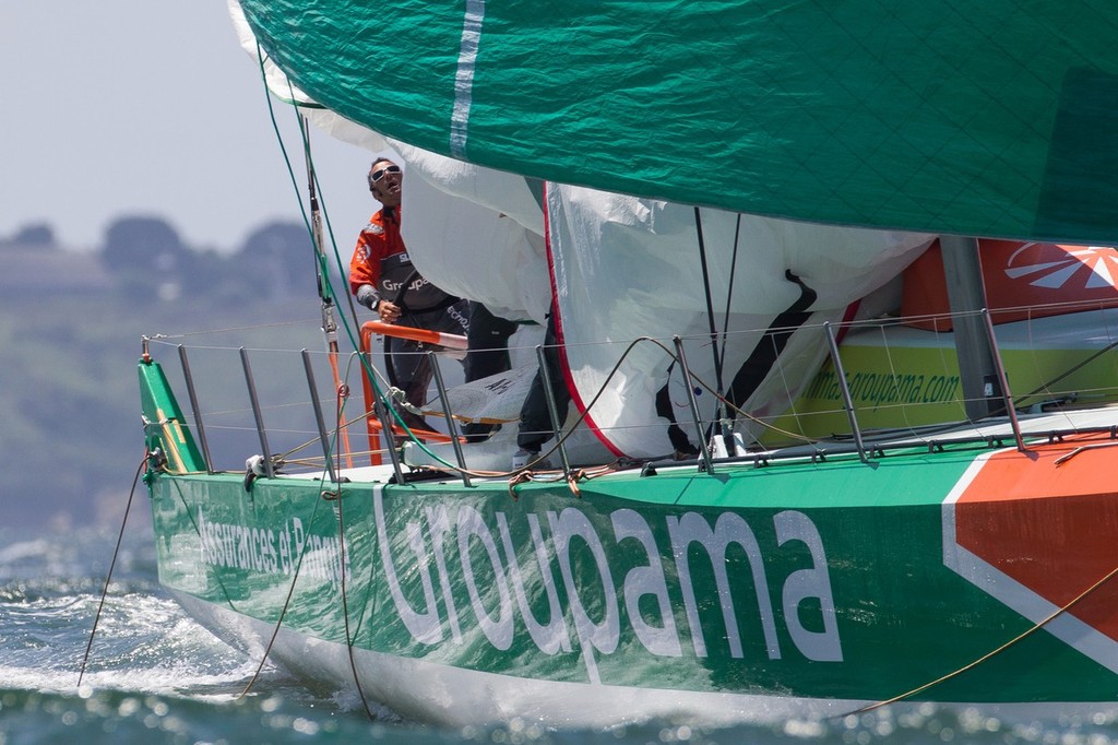 Groupama Sailing Team pull down their spinnaker, during the Bretagne In-Port Race, in Lorient, France, during the Volvo Ocean Race 2011-12.  © Ian Roman/Volvo Ocean Race http://www.volvooceanrace.com