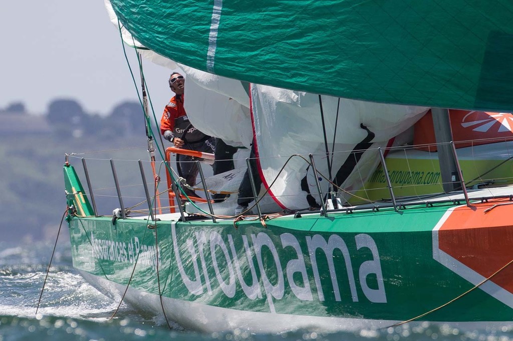 Groupama Sailing Team, skippered by Franck Cammas from France, pull down their spinnaker, during the Bretagne In-Port Race, in Lorient, France, during the Volvo Ocean Race 2011-12. © Ian Roman/Volvo Ocean Race http://www.volvooceanrace.com