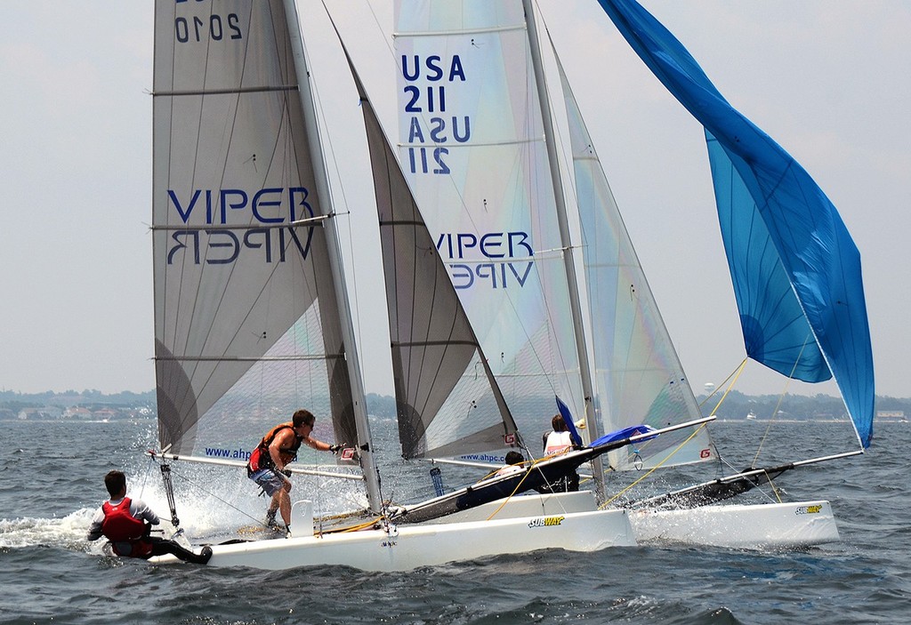 Formula 16 cats flying downwind in their first ever Junior Olympic Regatta for an olympic style catamaran. Matthew Whitehead (USA 211 St Andrews Bay YC) has a bow our and chute setting ahead of Michael Rice (2010 Pensacola YC). The 2012 US Sailing Junior Olympic and SUBWAY® Sail Fest held at Pensacola Yacht Club on June 29 & 30 and July 1st. Credit Talbot Wilson photo copyright Talbot Wilson taken at  and featuring the  class
