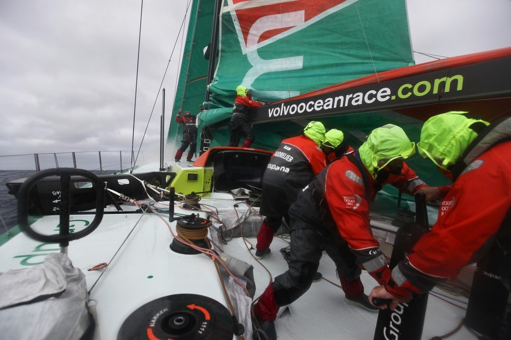 The Groupama Sailing Team crew try to put the mainsail back up after it got stuck while they were putting in a reef, during leg 8 of the Volvo Ocean Race 2011-12, from Lisbon, Portugal to Lorient, France. (Credit: Yann Riou/Groupama Sailing Team/Volvo Ocean Race) photo copyright Yann Riou/Groupama Sailing Team /Volvo Ocean Race http://www.cammas-groupama.com/ taken at  and featuring the  class