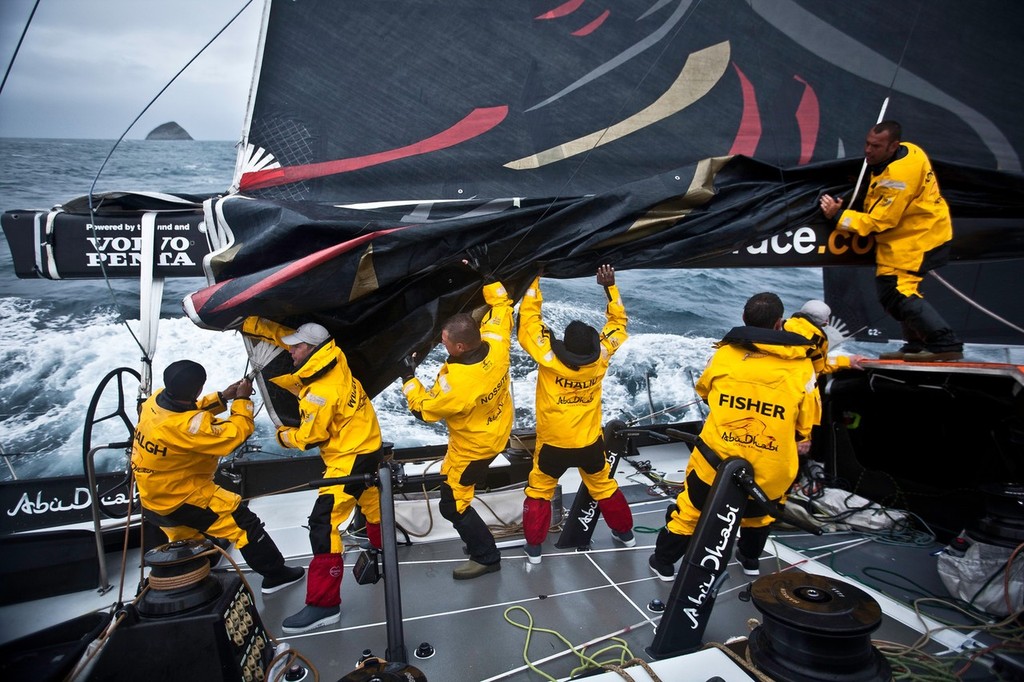 The crew during sail change onboard Abu Dhabi Ocean Racing during leg 5 of the Volvo Ocean Race 2011-12, from Sanya, China to Auckland, New Zealand. (Credit: Nick Dana/Abu Dhabi Ocean Racing/Volvo Ocean Race) photo copyright Nick Dana/Abu Dhabi Ocean Racing /Volvo Ocean Race http://www.volvooceanrace.org taken at  and featuring the  class