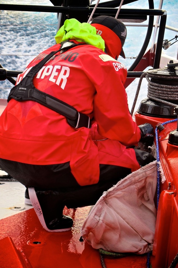 Adam Minoprio inspects a rope tail bag which was ripped from the cockpit by a big wave onboard CAMPER with Emirates Team New Zealand during leg 5 of the Volvo Ocean Race 2011-12, from Auckland, New Zealand to Itajai, Brazil. (Credit: Hamish Hooper/CAMPER ETNZ/Volvo Ocean Race) photo copyright Hamish Hooper/Camper ETNZ/Volvo Ocean Race taken at  and featuring the  class
