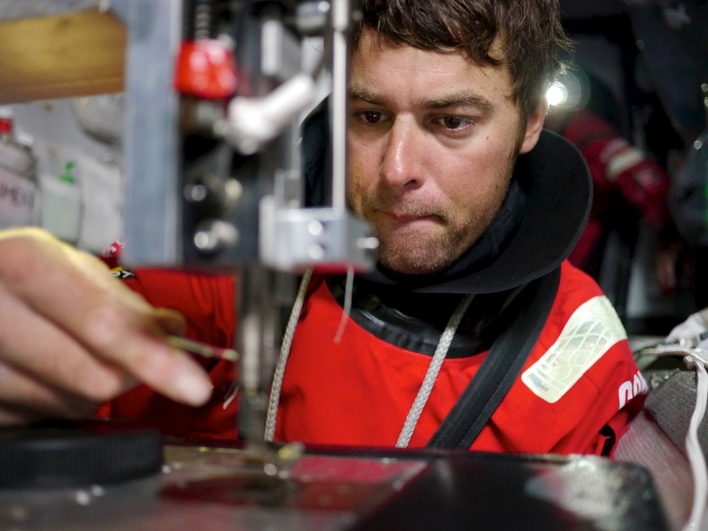 Daryl Wislang repairs a ripper rep tail bag which was ripped off by a wave onboard CAMPER with Emirates Team New Zealand during leg 5 of the Volvo Ocean Race 2011-12, from Auckland, New Zealand to Itajai, Brazil. © Hamish Hooper/Camper ETNZ/Volvo Ocean Race