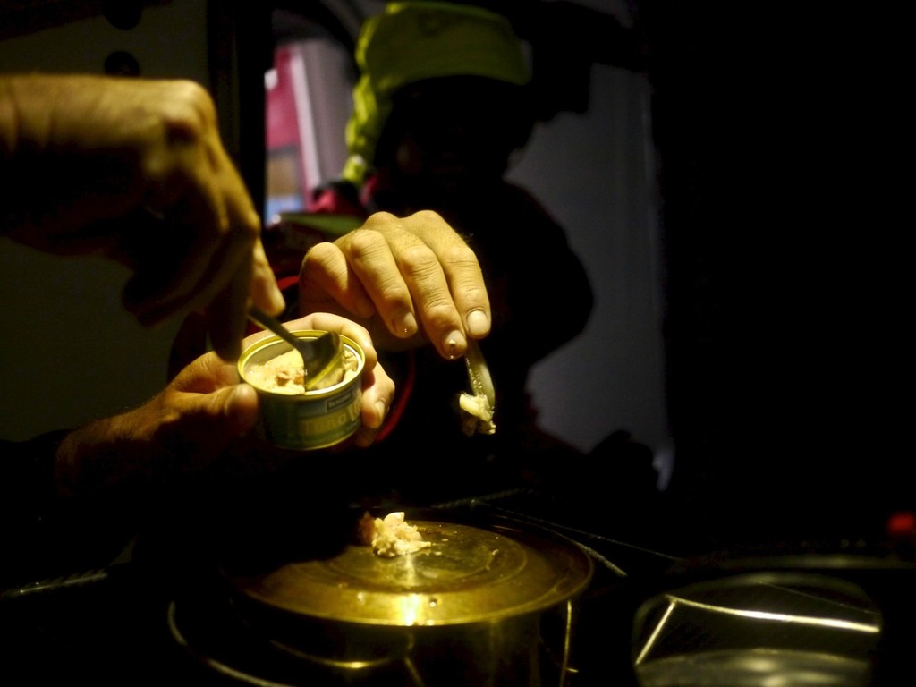Tuna and fresh Calamari on the bottom of a kettle onboard Camper  during leg 5 of the Volvo Ocean Race 2011-12, from Auckland, New Zealand to Itajai, Brazil.  © Hamish Hooper/Camper ETNZ/Volvo Ocean Race