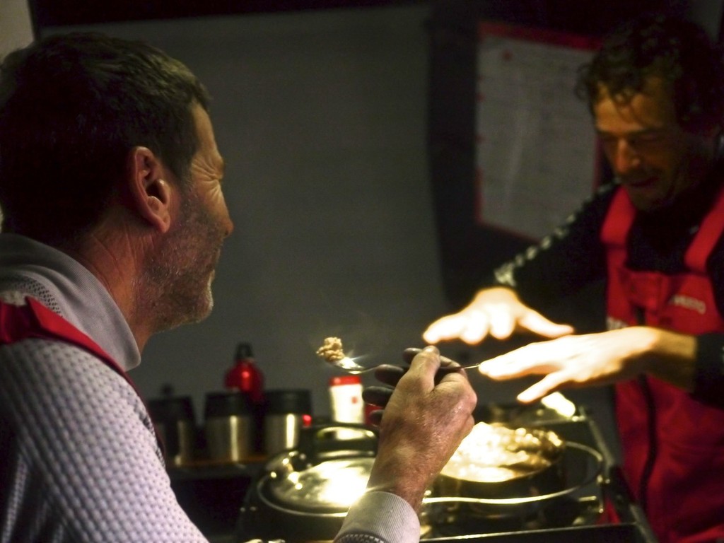 Rob Salthouse and Roberto Bermudez De Castro enjoy fresh calamari and tuna cooked on the bottom of the kettle onboard Camper during leg 5 of the Volvo Ocean Race 2011-12, from Auckland, New Zealand to Itajai, Brazil.  © Hamish Hooper/Camper ETNZ/Volvo Ocean Race