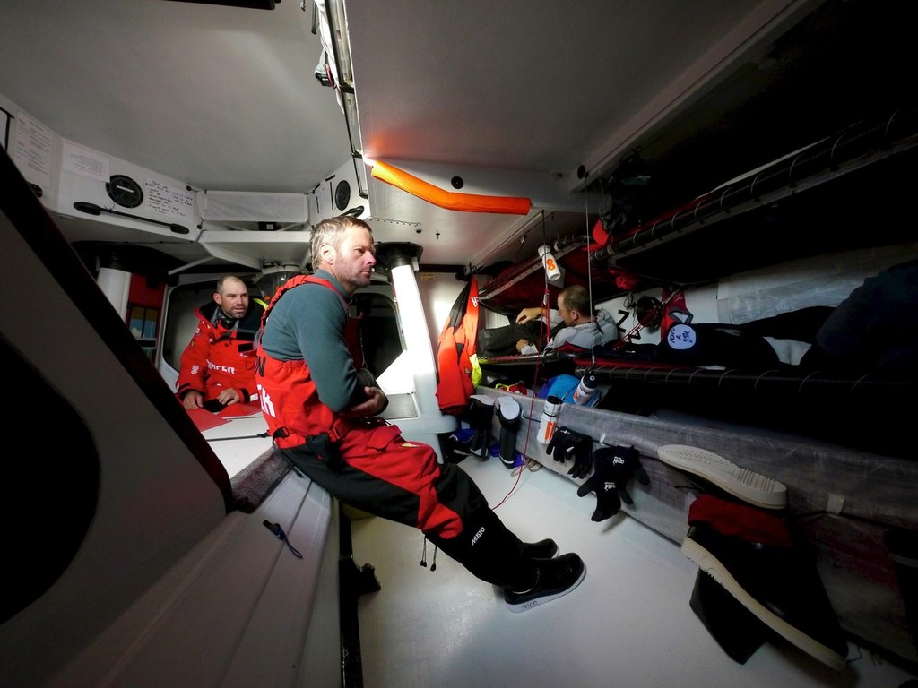 Stuart Bannatyne and Chris Nicholson take time out below as Andy McLean hops into his warm bunk onboard CAMPER with Emirates Team New Zealand during leg 5 of the Volvo Ocean Race 2011-12, from Auckland, New Zealand to Itajai, Brazil. (Credit: Hamish Hooper/CAMPER ETNZ/Volvo Ocean Race) photo copyright Hamish Hooper/Camper ETNZ/Volvo Ocean Race taken at  and featuring the  class