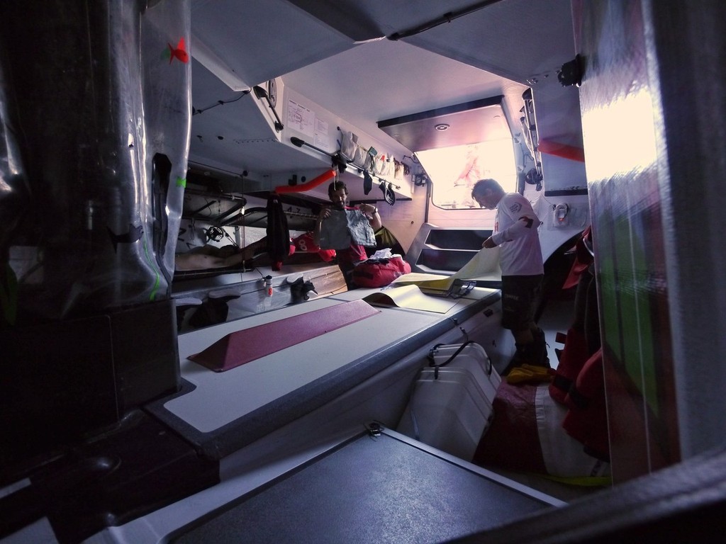 Some early preparations for reaching Itajai, change of clothes and checking charts onboard Camper with Emirates Team New Zealand during leg 5 of the Volvo Ocean Race 2011-12, from Auckland, New Zealand to Itajai, Brazil.  © Hamish Hooper/Camper ETNZ/Volvo Ocean Race