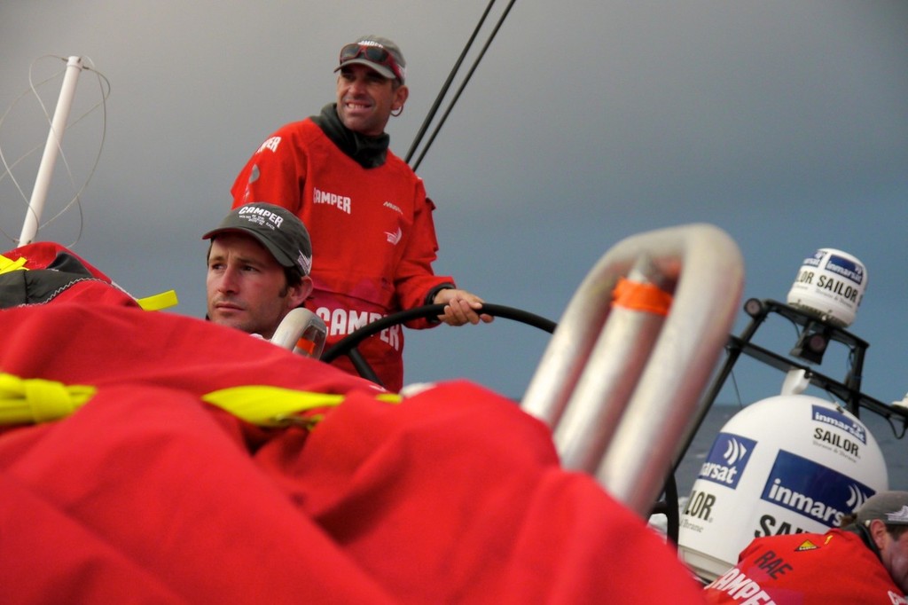 Adam Minoprio trims the main, while Stuart Bannatyne drives, onboard Camper with Emirates Team New Zealand during leg 8 of the Volvo Ocean Race 2011-12, from Lisbon, Portugal to Lorient, France.  © Hamish Hooper/Camper ETNZ/Volvo Ocean Race