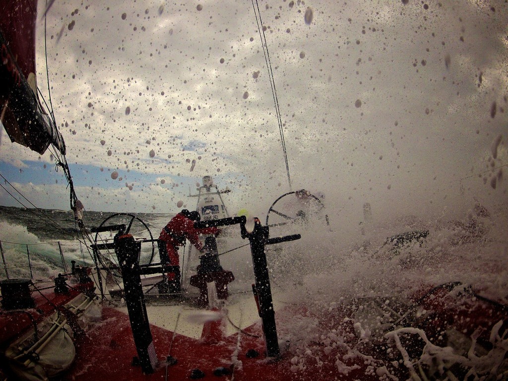 A wave of white water obscures the view of the crew, onboard Camper with Emirates Team New Zealand during Leg 8 of the Volvo Ocean Race 2011-12, from Lisbon, Portugal to Lorient, France.  © Hamish Hooper/Camper ETNZ/Volvo Ocean Race