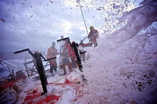 Huge walls of white water crash over the deck onboard Camper with Emirates Team New Zealand during leg 8 of the Volvo Ocean Race 2011-12, from Lisbon, Portugal to Lorient, France.  © Hamish Hooper/Camper ETNZ/Volvo Ocean Race