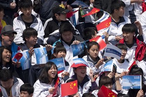Chinese school children enjoying the racing on the first day in Qingdao - Act 2, Day 1, Extreme Sailing Series 2012 photo copyright Lloyd Images http://lloydimagesgallery.photoshelter.com/ taken at  and featuring the  class