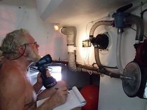 Nico Budel checks the wiring in the aft compartment on Sec Hayai - Global Ocean Race 2011-12 photo copyright Sec. Hayai taken at  and featuring the  class