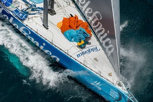 Team Telefonica, pulling down a sail, at the start of leg 8 from Lisbon, Portugal to Lorient, France, during the Volvo Ocean Race 2011-12. photo copyright Paul Todd/Volvo Ocean Race http://www.volvooceanrace.com taken at  and featuring the  class