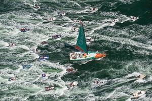 Groupama Sailing Team, skippered by Franck Cammas from France, are followed in by a huge fleet of spectator boats, after claiming victory in the Bretagne In-Port Race, in Lorient, France,  during the Volvo Ocean Race 2011-12. (Credit: PAUL TODD/Volvo Ocean Race) photo copyright Paul Todd/Outside Images http://www.outsideimages.com taken at  and featuring the  class