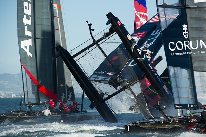 Oracle Team USA digs the bows in and capsizes at the first mark in the first fleet race of day four of the America’s Cup World Series, San Francisco.  ©  SW