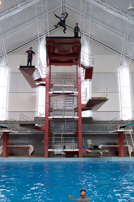 Emirates Team New Zealand AC72 sailors practice safety procedures in the Henderson West Wave dive pool. Glenn Ashby jumps from the 10M platform. 7/11/2012 © Chris Cameron/ETNZ http://www.chriscameron.co.nz