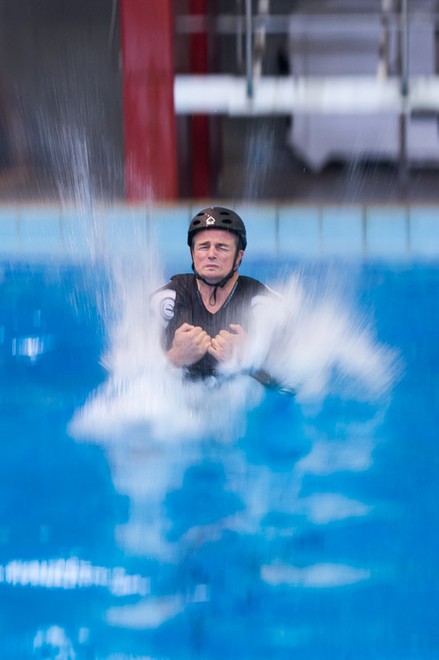 Emirates Team New Zealand AC72 sailors practice safety procedures in the Henderson West Wave dive pool. Winston McFarlane making a splash7/11/2012 © Chris Cameron/ETNZ http://www.chriscameron.co.nz