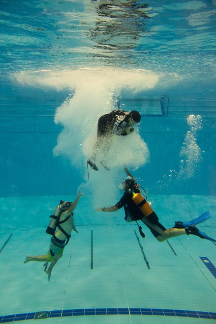 Emirates Team New Zealand AC72 sailors practice safety procedures in the Henderson West Wave dive pool. 7/11/2012 © Chris Cameron/ETNZ http://www.chriscameron.co.nz