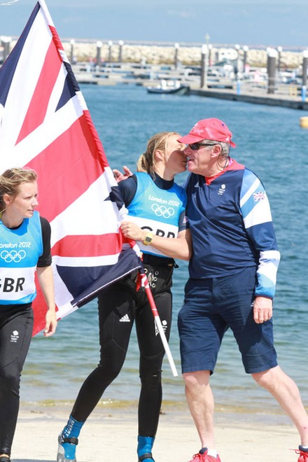 Olympic Games Sailing at Weymouth, Dorset August 2012. The Women’s 470 medal race on the Nothe course. Hannah Mills and Saskia Clarke win silver for Great Britain.  Ian Howlet, Ben Ainslie’s coach and four times gold medal coach congratulates Saskia and Hannah © Ingrid Abery http://www.ingridabery.com