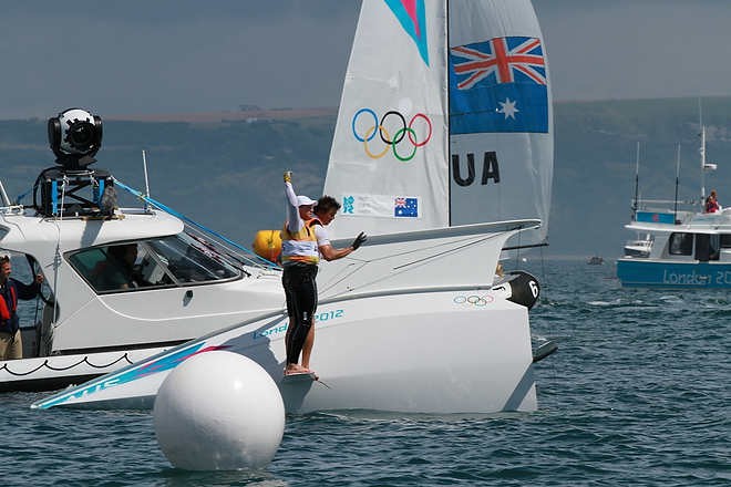 Olympic Games Sailing at Weymouth, Dorset August 2012. Australia’s Nathan Outteridge (helmsman in baseball cap) and Ian Jensen celebrate winning gold in the 49er class at the London Olympics. © Ingrid Abery http://www.ingridabery.com