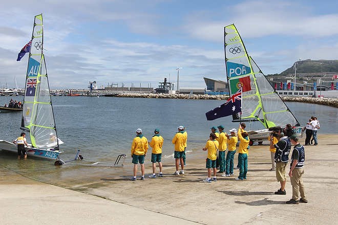 Olympic Games Sailing at Weymouth, Dorset August 2012. Australia’s Nathan Outteridge (helmsman in baseball cap) and Ian Jensen celebrate winning gold in the 49er class at the London Olympics. © Ingrid Abery http://www.ingridabery.com