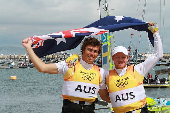 Olympic Games Sailing at Weymouth, Dorset August 2012. Australia’s Nathan Outteridge (helmsman in baseball cap) and Ian Jensen celebrate winning gold in the 49er class at the London Olympics. © Ingrid Abery http://www.ingridabery.com