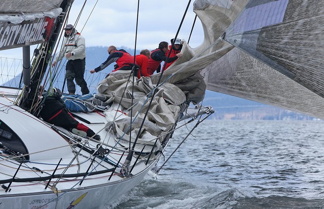 Foredeck crew make the last sail change. - Rolex Sydney Hobart Race 2012 © Crosbie Lorimer http://www.crosbielorimer.com
