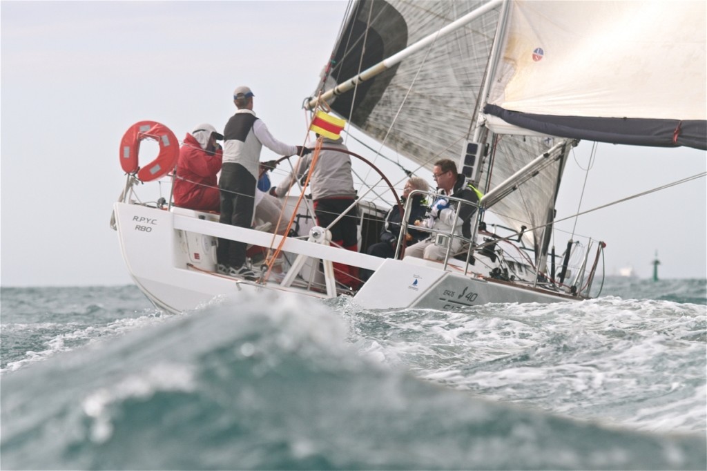 Winged – a forlorn Tony Carter sits in the starboard corner of Just Cruisin’ cradling his injured hand as the boat limps home for the Division Two Line Honours/IRC double. photo copyright Bernie Kaaks taken at  and featuring the  class