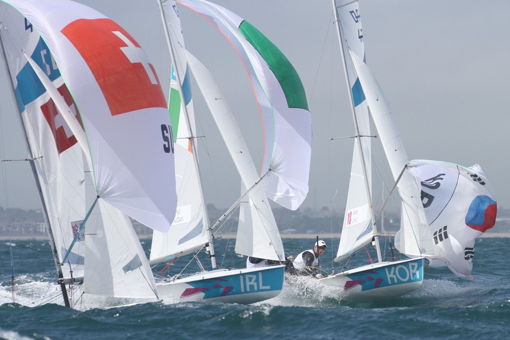 August 1, 2012 - Weymouth, England - 470 Men - Switzerland, Ireland and Korea contest at the gybe mark © Richard Gladwell www.photosport.co.nz