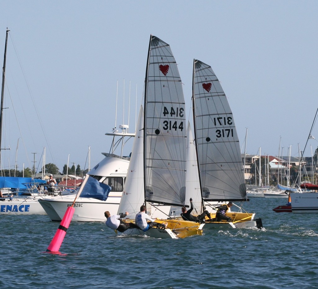 Fris Fay and Morgan Freww edge out Trevor Fay and Nigel Blatchford at the finish of Race 4. © Fiona Lunsmann