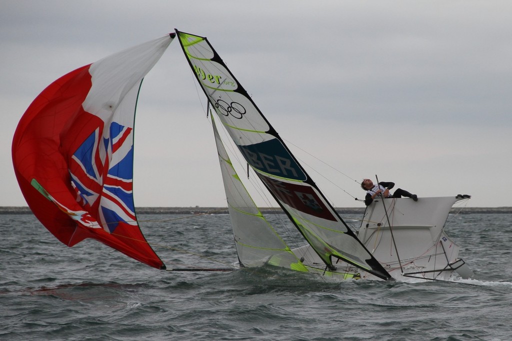 August 1, 2012 - Weymouth, England - 49er crewman Alexander Kirkland (BER) screams in agony as their 49er, he races with brother Jesse Kirkland, capsizes close to the finish. They were unable to right their boat and continue sailing photo copyright Richard Gladwell www.photosport.co.nz taken at  and featuring the  class