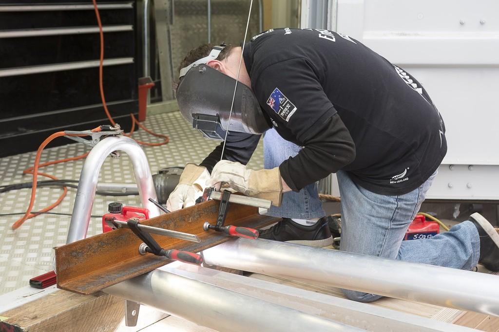 Emirates Team New Zealand work on the champagne bottle aparatus for the launch of the team’s first AC72.  © Chris Cameron/ETNZ http://www.chriscameron.co.nz