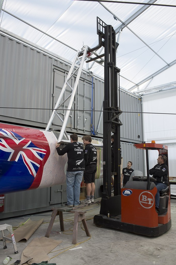 Emirates Team New Zealand work on the champagne bottle aparatus for the launch of the team’s first AC72. photo copyright Chris Cameron/ETNZ http://www.chriscameron.co.nz taken at  and featuring the  class