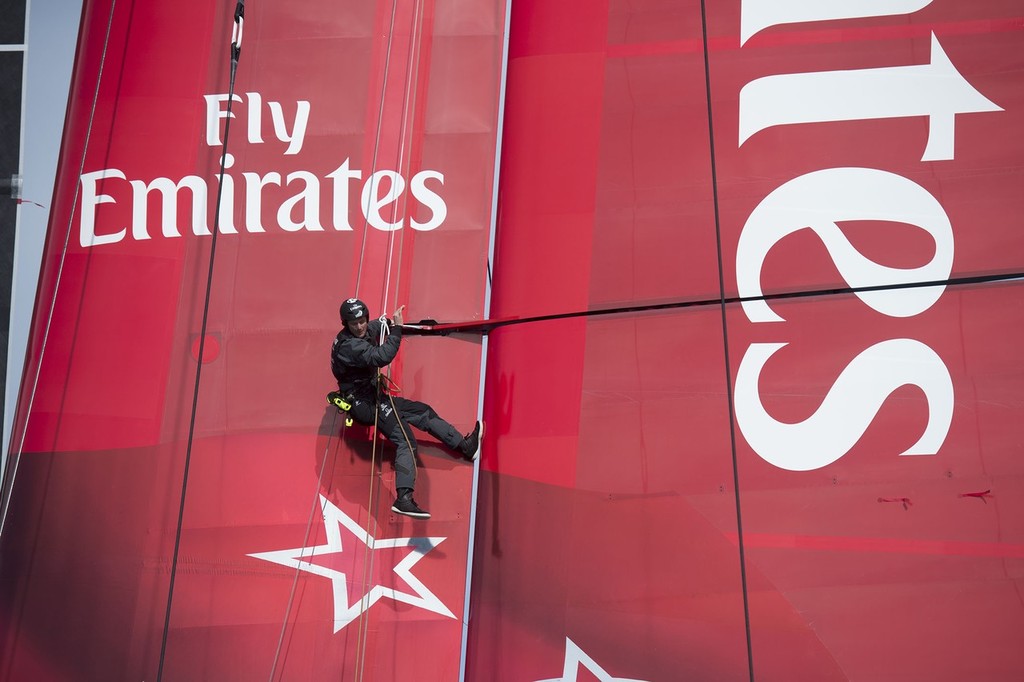 Emirates Team New Zealand sailing the AC72 on the Hauraki Gulf on the second day of sailing. A bang brings an end to sailing as a part in the wing gives way.Richard Meacham goes aloft to check the damage and take some photos for the designers. 3/8/2012 photo copyright Chris Cameron/ETNZ http://www.chriscameron.co.nz taken at  and featuring the  class