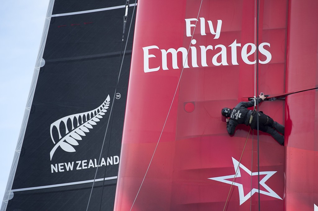 Emirates Team New Zealand sailing the AC72 on the Hauraki Gulf on the second day of sailing. A bang brings an end to sailing as a part in the wing gives way.Richard Meacham goes aloft to check the damage and take some photos for the designers. 3/8/2012 © Chris Cameron/ETNZ http://www.chriscameron.co.nz