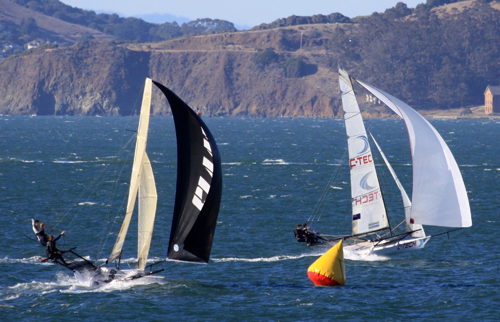C-Tech (r.) passes Australia’s Grant Rollerson to seize first place  - International 18 Skiff Regatta 2012 Day 1 © Rich Roberts http://www.UnderTheSunPhotos.com