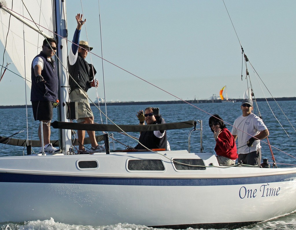 Art Melendres (at mast) and crew wave thanks at race committee team as they cross the line winning the 2012 Cal 25 Fleet V Championship. © Rick Roberts 