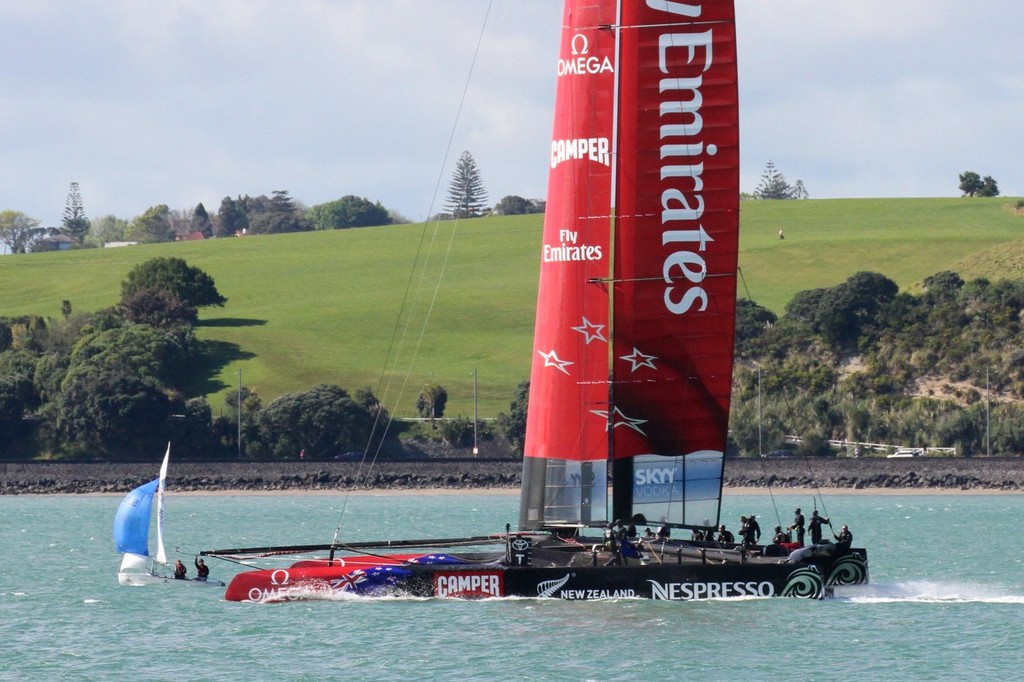 Emirates Team NZ passes a 420 as she heads down the harbour on Day 10 - Emirates Team NZ AC72 October 12,2012 photo copyright Richard Gladwell www.photosport.co.nz taken at  and featuring the  class