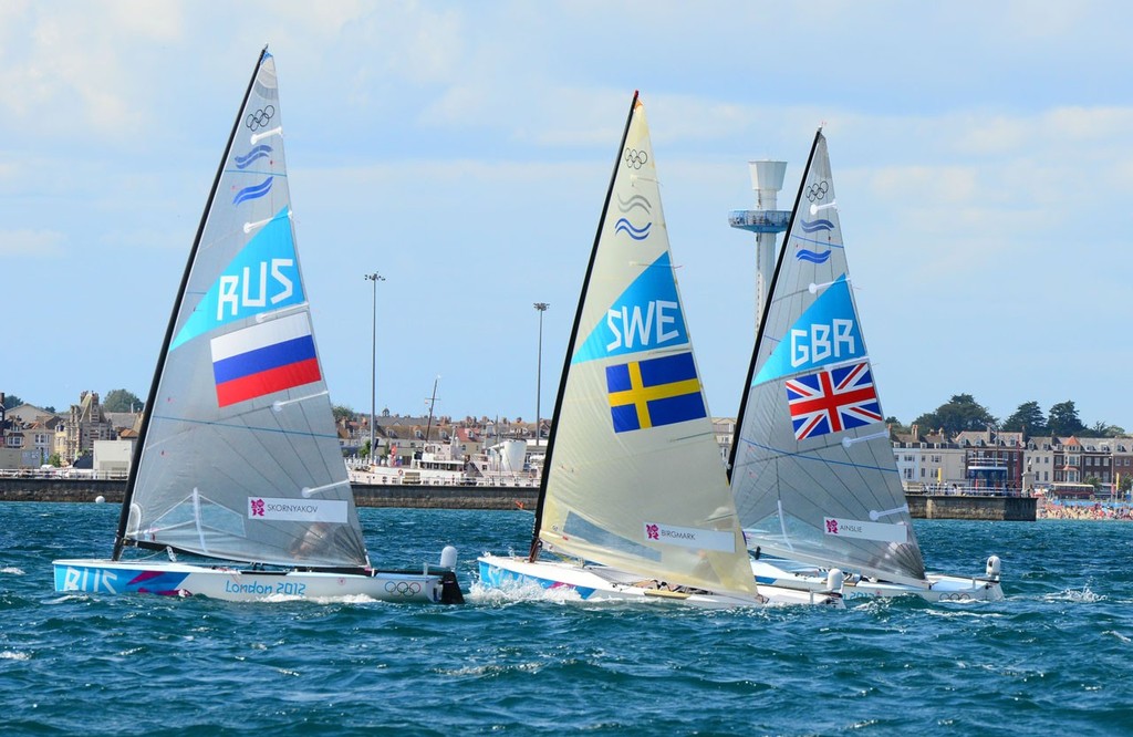 Finn start - SWE AUS GBR  - London 2012 Olympic Sailing Competition Practice Day photo copyright Sail-World.com http://www.sail-world.com taken at  and featuring the  class