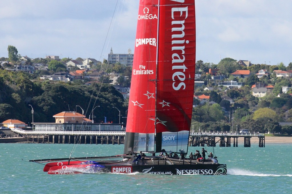 Emirates Team NZ’s AC72 slides past Orakei Wharf on her way to start the tenth day of sailing since launch photo copyright Richard Gladwell www.photosport.co.nz taken at  and featuring the  class