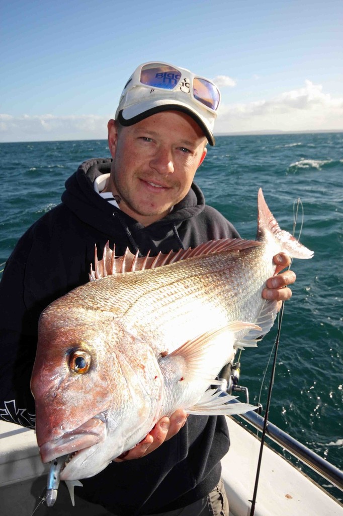 The author with a solid red caught on a 110mm pilly flick bait. photo copyright Jarrod Day taken at  and featuring the  class