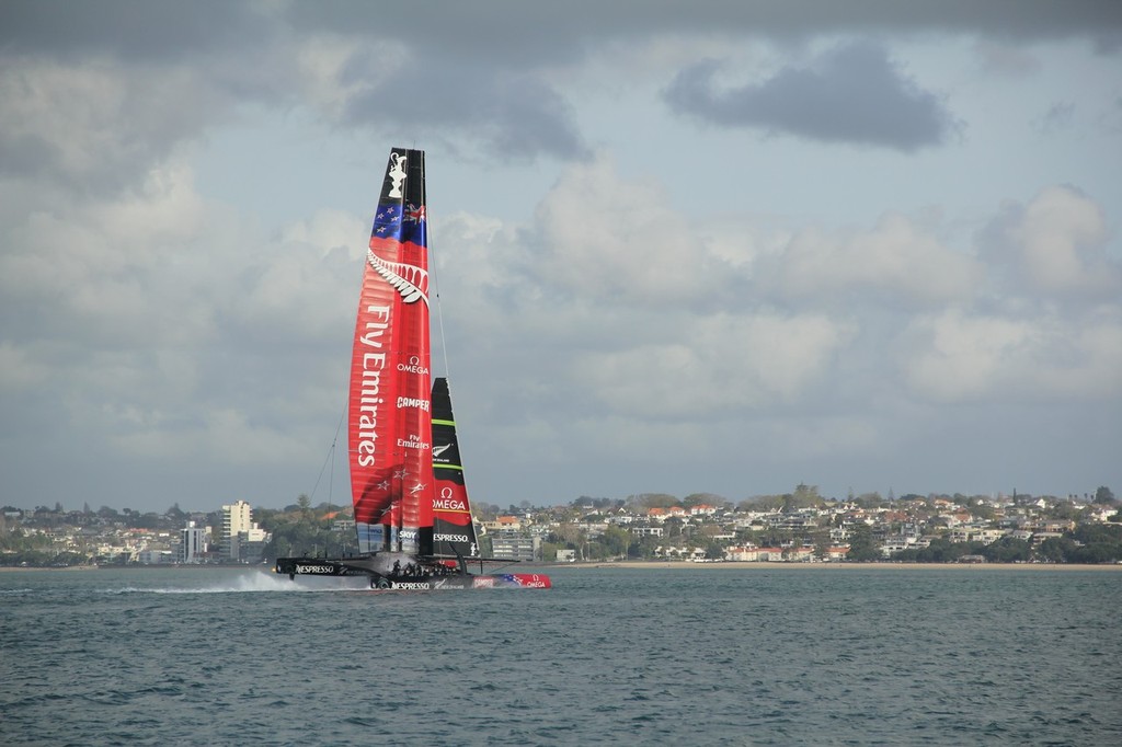 2 - Emirates Team NZ - AC72 - drops onto her windward hull after the wind drops off North Head. She was put onto the tow soon afterwards off North Head  September 6, 2012 © Wright Images http://www.sail-world.com