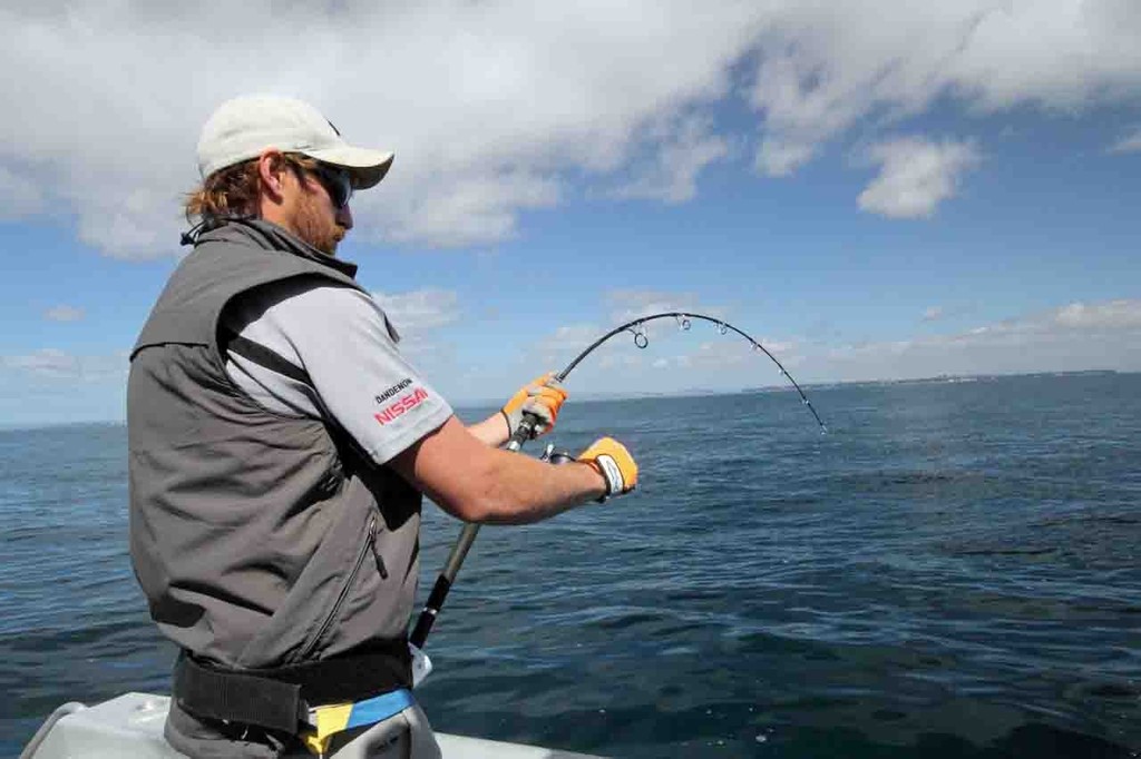 Scott hooked up to a solid king. © Jarrod Day