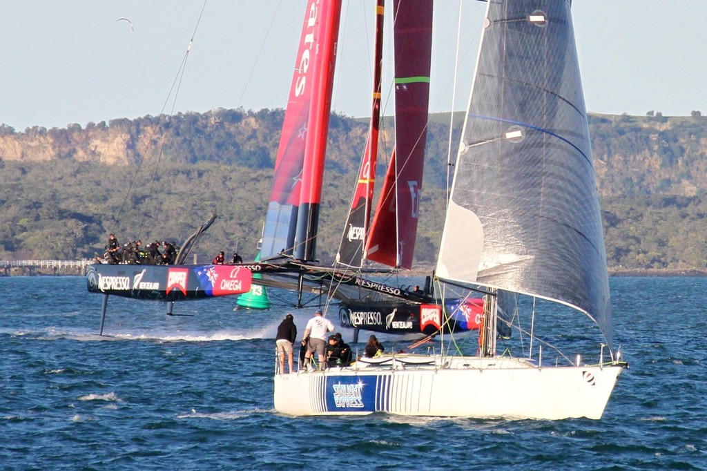 IMG 8385 - Emirates Team NZ turns downwind and is close to paralleling the course of the keelboat sailing goosewinged and running dead downwind. Windward foil is retracted. Windward rudder has lifted clear of the water, but balance is maintained. photo copyright Richard Gladwell www.photosport.co.nz taken at  and featuring the  class