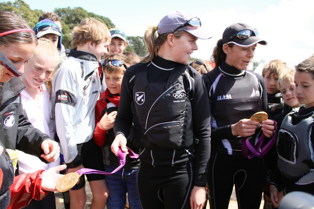 Olivia Powrie and Jo Aleh show their medals at Kohimaramara Yacht Club  Sunday September 23, 2012 .  © Richard Gladwell www.photosport.co.nz