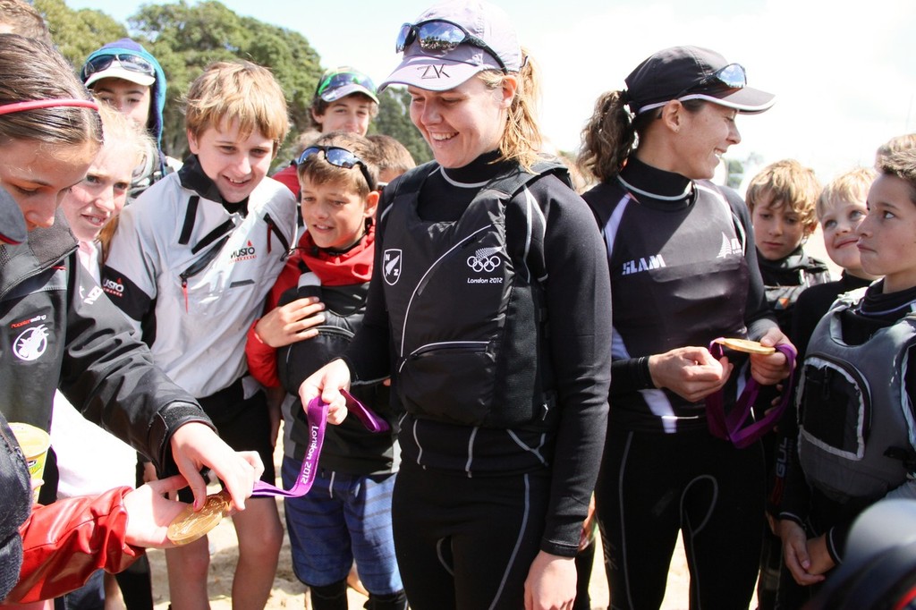 Olivia Powrie and Jo Aleh show off their medals  at Kohimaramara Yacht Club  Sunday Sptember 23, 2012  © Richard Gladwell www.photosport.co.nz