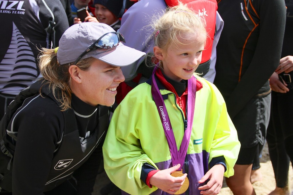 Olivia Powrie poses with a young sailor at Kohimaramara Yacht Club  Sunday September 23, 2012  © Richard Gladwell www.photosport.co.nz