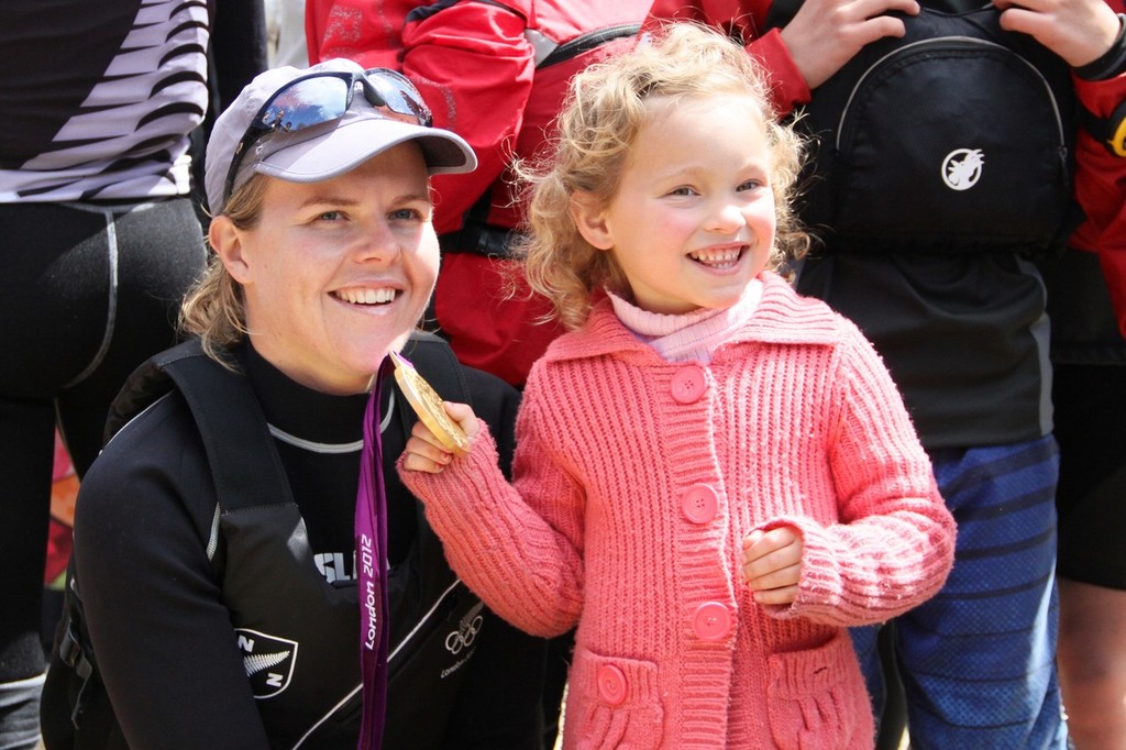 Polly Powrie makes a young catch at Kohimaramara Yacht Club  Sunday Sptember 23, 2012 © Richard Gladwell www.photosport.co.nz