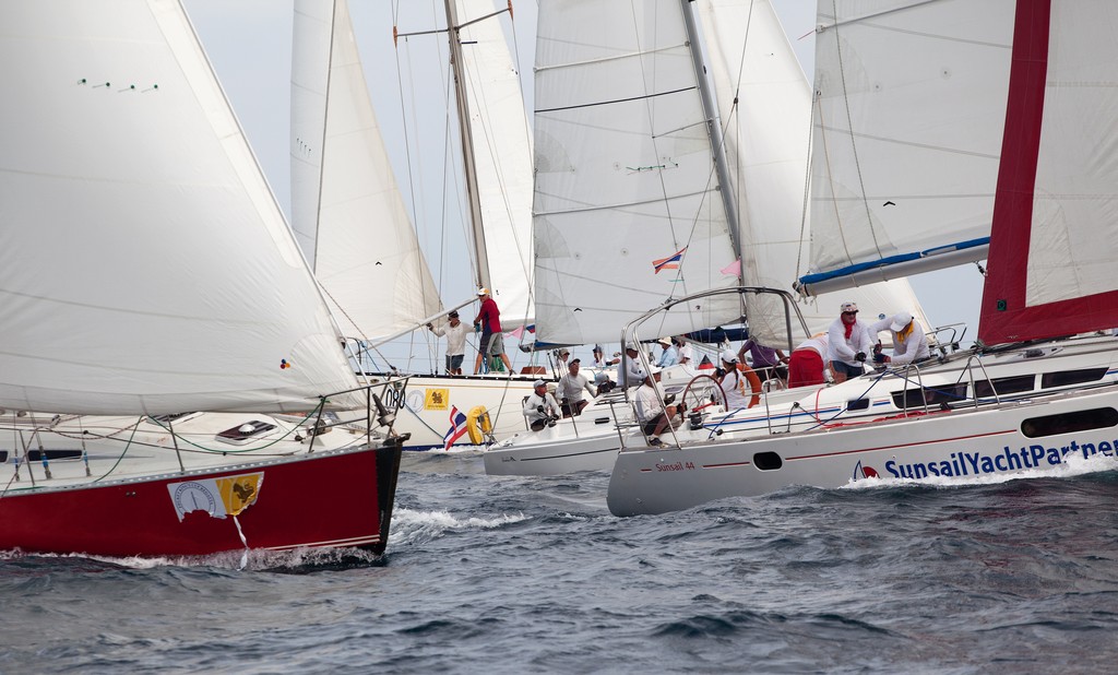 Phuket King’s Cup 2012. Heavy traffic at the leeward mark. Bareboat Charter. © Guy Nowell